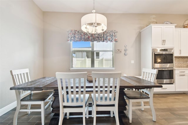 11852 Lake Lucaya Dr, Riverview, FL 33579 - dining space featuring baseboards, an inviting chandelier, and wood finished floors