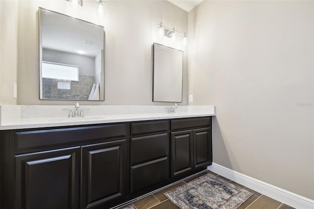 11852 Lake Lucaya Dr, Riverview, FL 33579 - full bath with double vanity, a sink, and baseboards