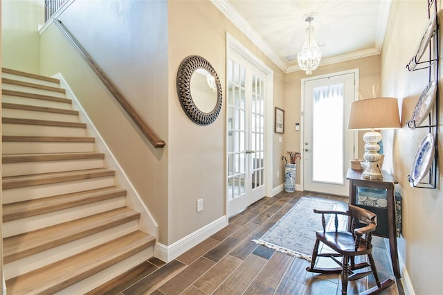 11852 Lake Lucaya Dr, Riverview, FL 33579 - entryway featuring ornamental molding, baseboards, wood tiled floor, stairway, and a chandelier