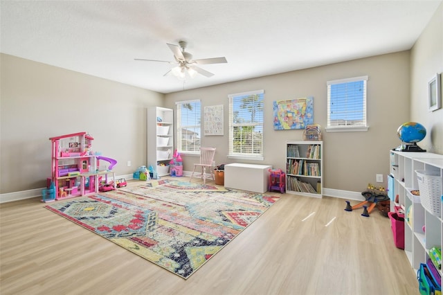 11852 Lake Lucaya Dr, Riverview, FL 33579 - rec room with baseboards, a ceiling fan, and wood finished floors