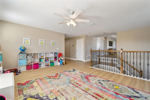 11852 Lake Lucaya Dr, Riverview, FL 33579 - recreation room featuring visible vents, a ceiling fan, baseboards, and wood finished floors
