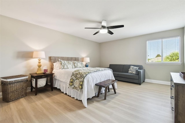 11852 Lake Lucaya Dr, Riverview, FL 33579 - bedroom with light wood-type flooring, baseboards, and ceiling fan