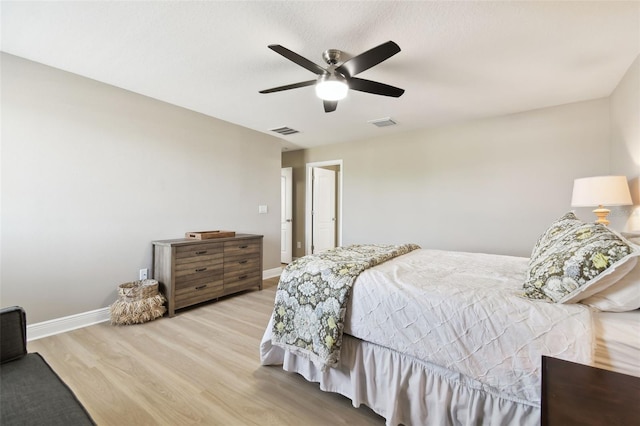 11852 Lake Lucaya Dr, Riverview, FL 33579 - bedroom with baseboards, a ceiling fan, wood finished floors, and visible vents