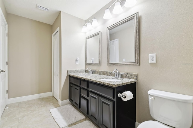 11852 Lake Lucaya Dr, Riverview, FL 33579 - full bath featuring a sink, toilet, double vanity, and visible vents