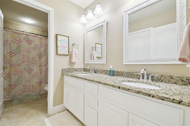 11852 Lake Lucaya Dr, Riverview, FL 33579 - bathroom featuring double vanity, a sink, baseboards, and toilet