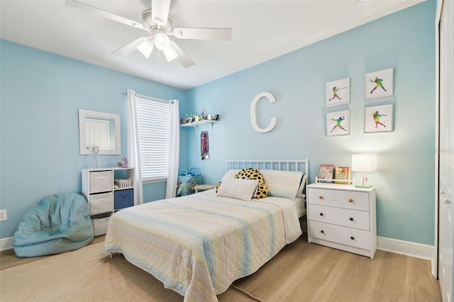 11852 Lake Lucaya Dr, Riverview, FL 33579 - bedroom featuring baseboards, ceiling fan, and wood finished floors