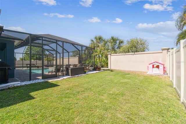 11852 Lake Lucaya Dr, Riverview, FL 33579 - view of yard with glass enclosure, a fenced in pool, a fenced backyard, and a patio area