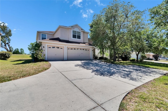 13421 Sydney Rd, Valrico, FL 33594 - traditional-style house with an attached garage, driveway, a front yard, and stucco siding