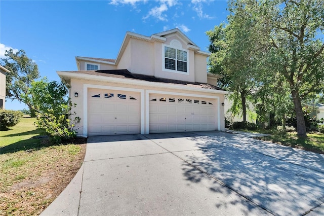 13421 Sydney Rd, Valrico, FL 33594 - traditional-style home with stucco siding, an attached garage, and concrete driveway