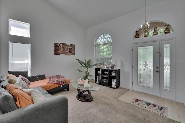 13421 Sydney Rd, Valrico, FL 33594 - carpeted living room with high vaulted ceiling and a chandelier