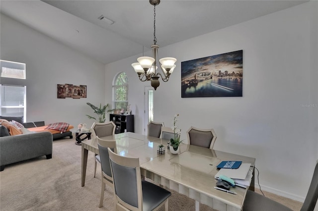 13421 Sydney Rd, Valrico, FL 33594 - dining area featuring vaulted ceiling, light colored carpet, baseboards, a notable chandelier, and visible vents