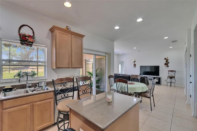 13421 Sydney Rd, Valrico, FL 33594 - kitchen with a sink, recessed lighting, light tile patterned floors, and a kitchen island