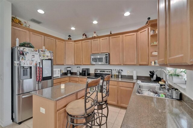 13421 Sydney Rd, Valrico, FL 33594 - kitchen featuring light tile patterned flooring, visible vents, stainless steel appliances, and a sink