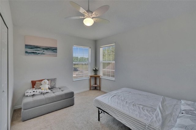13421 Sydney Rd, Valrico, FL 33594 - carpeted bedroom with baseboards and ceiling fan
