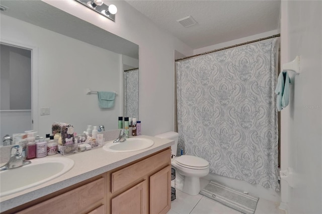 13421 Sydney Rd, Valrico, FL 33594 - full bathroom featuring tile patterned floors, visible vents, a sink, and toilet