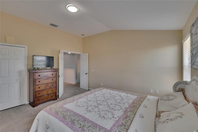 13421 Sydney Rd, Valrico, FL 33594 - bedroom featuring vaulted ceiling, visible vents, and light colored carpet