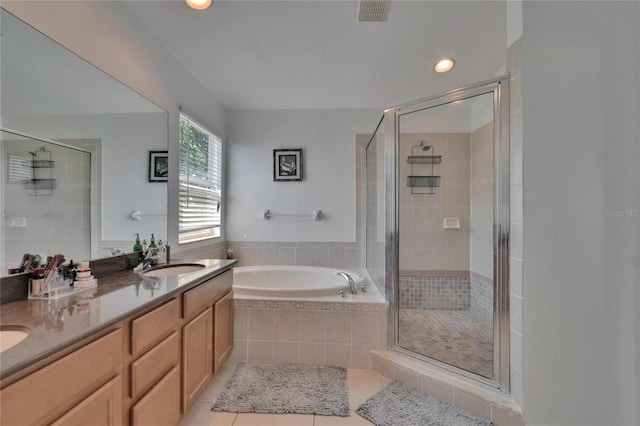 13421 Sydney Rd, Valrico, FL 33594 - bathroom with a shower stall, tile patterned flooring, a sink, and visible vents