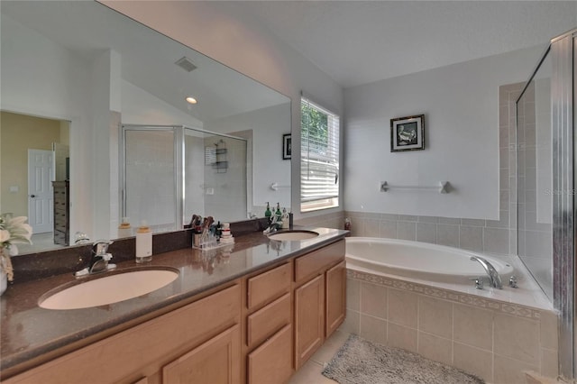 13421 Sydney Rd, Valrico, FL 33594 - bathroom featuring a garden tub, a sink, visible vents, and a stall shower