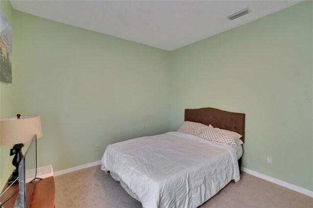 13421 Sydney Rd, Valrico, FL 33594 - carpeted bedroom featuring visible vents and baseboards