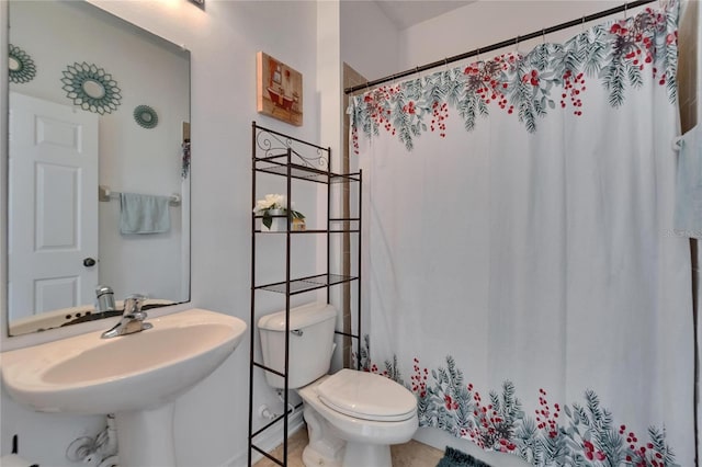 13421 Sydney Rd, Valrico, FL 33594 - full bath featuring toilet, tile patterned flooring, a shower with shower curtain, and a sink