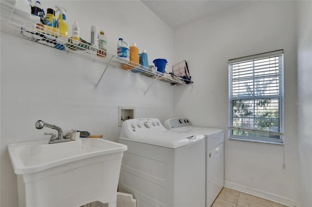 13421 Sydney Rd, Valrico, FL 33594 - clothes washing area with separate washer and dryer, a wealth of natural light, a sink, and laundry area