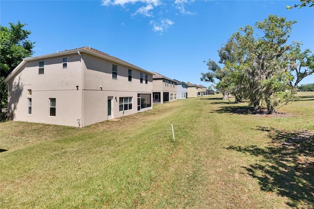13421 Sydney Rd, Valrico, FL 33594 - exterior space with a lawn and stucco siding