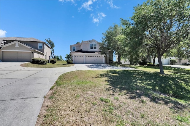 13421 Sydney Rd, Valrico, FL 33594 - view of front of property featuring stucco siding, a garage, a front lawn, and concrete driveway
