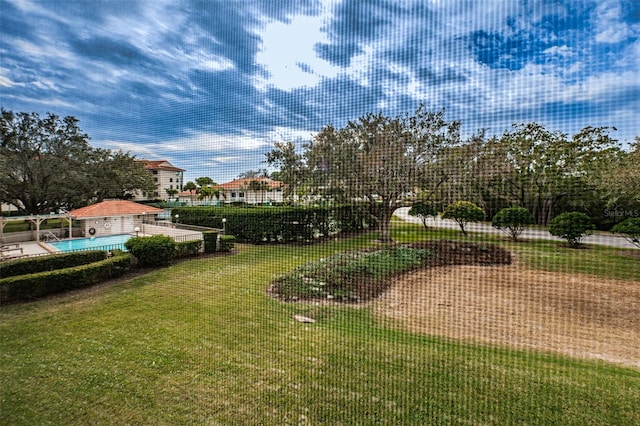 view of community featuring a yard