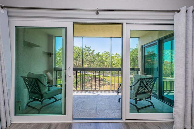 doorway to outside featuring wood finished floors