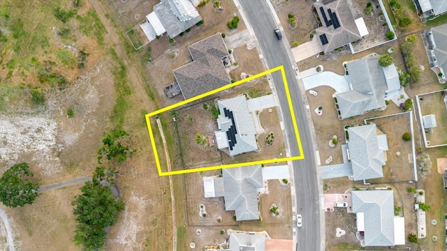 birds eye view of property with a residential view