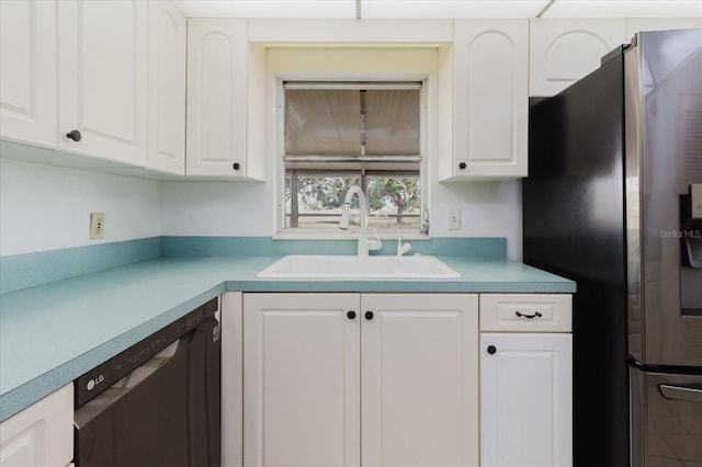 kitchen featuring stainless steel fridge, a sink, light countertops, white cabinetry, and dishwashing machine