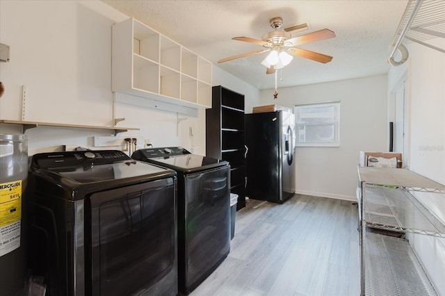 washroom with washer and dryer, laundry area, light wood-style flooring, water heater, and a ceiling fan