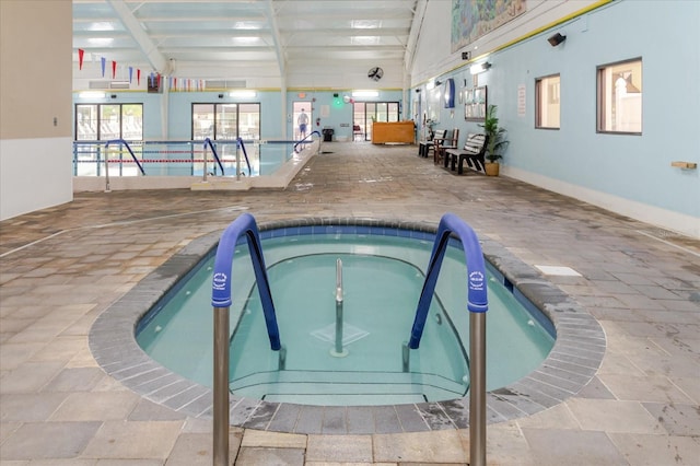 community pool with an indoor in ground hot tub