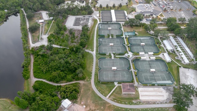 birds eye view of property with a water view
