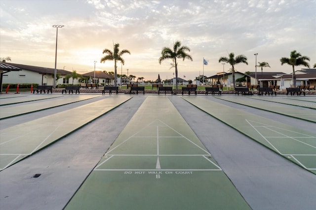 surrounding community with shuffleboard and a residential view