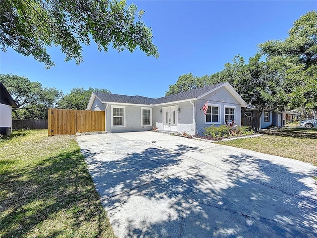 6811 S Himes Ave, Tampa, FL 33611 - ranch-style house with concrete driveway and stucco siding