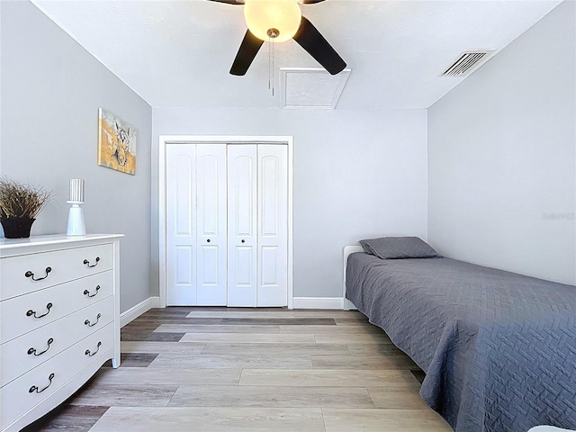 6811 S Himes Ave, Tampa, FL 33611 - bedroom featuring a closet, light wood finished floors, a ceiling fan, and baseboards