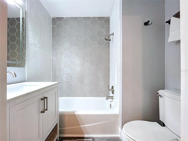 6811 S Himes Ave, Tampa, FL 33611 - full bath featuring toilet, vanity, and tub / shower combination