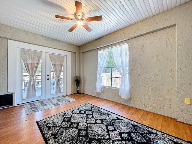 6811 S Himes Ave, Tampa, FL 33611 - entryway with a textured wall, french doors, a ceiling fan, wood finished floors, and wood ceiling