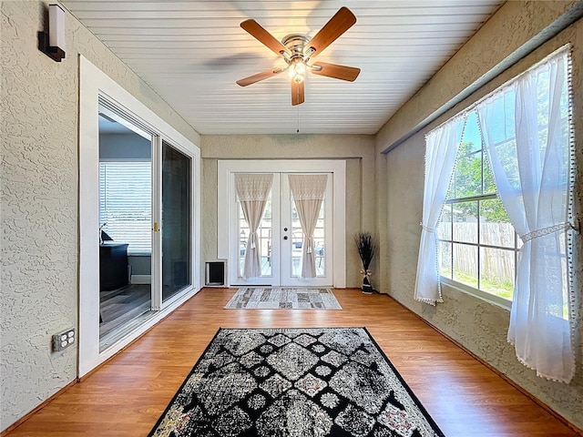 6811 S Himes Ave, Tampa, FL 33611 - entryway with french doors, a textured wall, ceiling fan, and wood finished floors