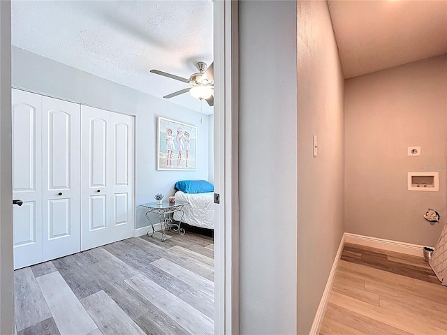 6811 S Himes Ave, Tampa, FL 33611 - bedroom featuring light wood-style floors, a closet, baseboards, and a ceiling fan