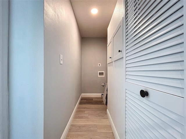6811 S Himes Ave, Tampa, FL 33611 - hall featuring light wood-style flooring and baseboards