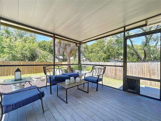 6811 S Himes Ave, Tampa, FL 33611 - sunroom / solarium featuring an outdoor living space with a fire pit