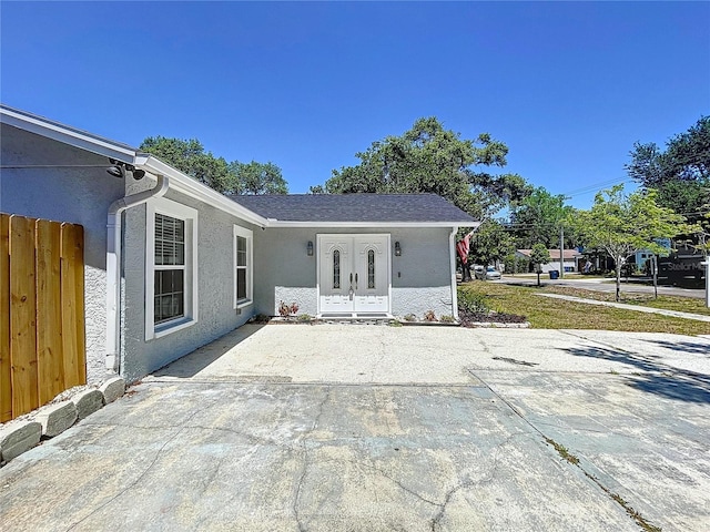 6811 S Himes Ave, Tampa, FL 33611 - back of house with stucco siding and french doors