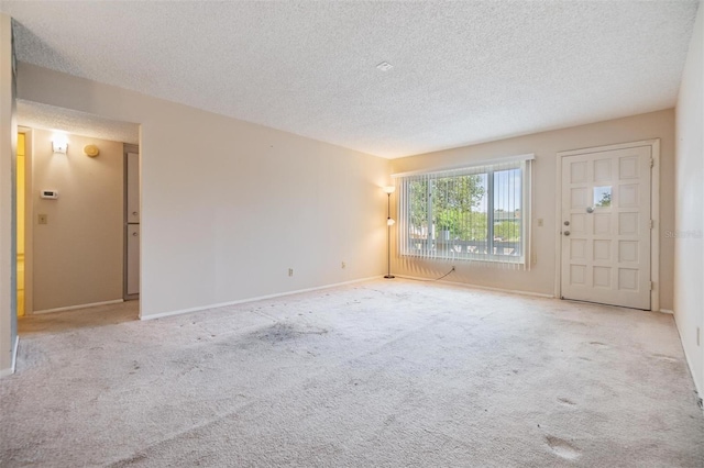 2310 Denmark St Unit 30, Clearwater, FL 33763 - carpeted foyer entrance with a textured ceiling and baseboards
