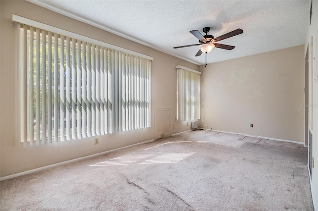 2310 Denmark St Unit 30, Clearwater, FL 33763 - carpeted spare room featuring ceiling fan, baseboards, and a textured ceiling