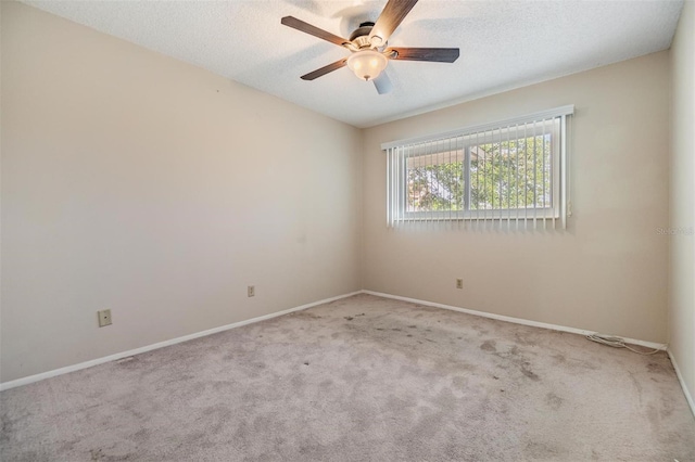 2310 Denmark St Unit 30, Clearwater, FL 33763 - carpeted empty room with a ceiling fan, baseboards, and a textured ceiling