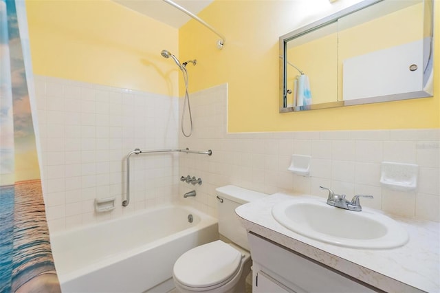 2310 Denmark St Unit 30, Clearwater, FL 33763 - bathroom with shower / bathtub combination with curtain, toilet, vanity, tile walls, and wainscoting
