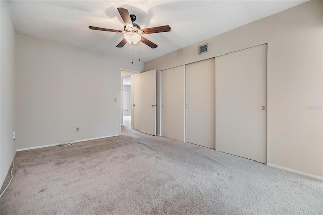 2310 Denmark St Unit 30, Clearwater, FL 33763 - unfurnished bedroom with carpet, a closet, a ceiling fan, and baseboards