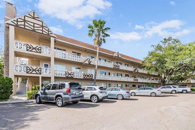 2310 Denmark St Unit 30, Clearwater, FL 33763 - view of building exterior with uncovered parking and stairway